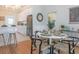 Dining area with wood floors, modern furnishings, and an open view into the kitchen at 2835 3Rd N Ave, St Petersburg, FL 33713