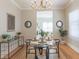 Dining room with chandelier, hardwood floors, round table and decorated console table at 2835 3Rd N Ave, St Petersburg, FL 33713