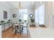 Dining room open to kitchen, featuring stylish table, chairs, and hardwood floors at 2835 3Rd N Ave, St Petersburg, FL 33713