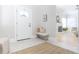 Inviting entryway with neutral tones, a bench, and a view into the light-filled living room at 2835 3Rd N Ave, St Petersburg, FL 33713