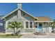 Charming bungalow-style home with a brick driveway, well-manicured lawn, and inviting light blue front door at 2835 3Rd N Ave, St Petersburg, FL 33713