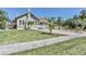 Spacious front yard featuring a charming bungalow-style home with a patterned driveway at 2835 3Rd N Ave, St Petersburg, FL 33713