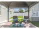 Cozy gazebo in a backyard setting with brick pavers, seating and a view of the home at 2835 3Rd N Ave, St Petersburg, FL 33713