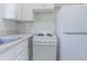 The kitchen includes a white refrigerator, stove, and cabinets with a window over the sink at 2835 3Rd N Ave, St Petersburg, FL 33713