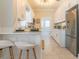Modern kitchen with white cabinets, stainless appliances, and a serving counter with barstool seating at 2835 3Rd N Ave, St Petersburg, FL 33713