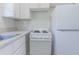 Efficient kitchen featuring white cabinets, stove, and refrigerator at 2835 3Rd N Ave, St Petersburg, FL 33713
