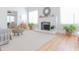 Bright living room with fireplace, light hardwood floors, rug, and tasteful decor at 2835 3Rd N Ave, St Petersburg, FL 33713