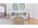 Bright living room featuring a comfortable white sofa, patterned pillows, and stylish decor at 2835 3Rd N Ave, St Petersburg, FL 33713