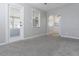 Spacious living room with plush carpeting and an open layout connecting to the kitchen at 2835 3Rd N Ave, St Petersburg, FL 33713