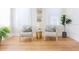 Bright living room with wood floors, neutral walls and two sitting chairs at 2835 3Rd N Ave, St Petersburg, FL 33713
