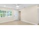 Bright living room featuring a large window, light floors, and a closet at 2935 47Th S Ave, St Petersburg, FL 33712