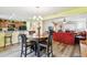 Open-concept dining area featuring a round table and views into the living room and kitchen at 3002 Mojave Oak Dr, Valrico, FL 33594