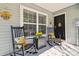 Inviting front porch featuring rocking chairs and welcoming sunflower decorations at 3002 Mojave Oak Dr, Valrico, FL 33594