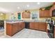 Bright eat-in kitchen with tile flooring, lots of cabinet space, and stainless steel appliances at 3002 Mojave Oak Dr, Valrico, FL 33594