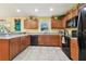 Bright kitchen with tile flooring, stainless steel appliances, lots of cabinet space, and sunny window at 3002 Mojave Oak Dr, Valrico, FL 33594