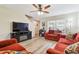 Cozy living room with a fireplace, hardwood floors, and abundant natural light at 3002 Mojave Oak Dr, Valrico, FL 33594
