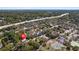 A lush, green aerial view of the neighborhood, the local park, and the proximity to the highway at 304 E Hanlon St, Tampa, FL 33604