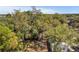 Mature trees surround this homes backyard, shading the home and providing curb appeal at 304 E Hanlon St, Tampa, FL 33604