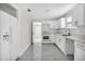 Bright, white kitchen featuring modern appliances, tile floors and ample cabinet space at 304 E Hanlon St, Tampa, FL 33604