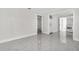 Bright living room featuring marble floors and an open layout flowing into the kitchen at 304 E Hanlon St, Tampa, FL 33604