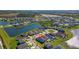 Overhead image of a residential area boasting a large pond and green spaces at 34244 Radley Way, Wesley Chapel, FL 33545
