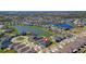 Bird's-eye view of a community showcasing homes around a picturesque body of water at 34244 Radley Way, Wesley Chapel, FL 33545