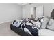 Modern bedroom featuring a comfortable bed and neutral color scheme at 34244 Radley Way, Wesley Chapel, FL 33545