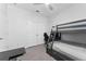 Bunkbed in bedroom with desk and ceiling fan at 34244 Radley Way, Wesley Chapel, FL 33545