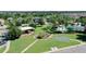 Aerial view showcasing a community park with playground, basketball court, and green space at 34244 Radley Way, Wesley Chapel, FL 33545