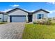 Charming single-Gathering home with a well-manicured lawn and inviting curb appeal on a sunny day at 34244 Radley Way, Wesley Chapel, FL 33545