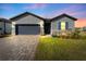 Charming single-Gathering home with a well-manicured lawn and inviting curb appeal on a sunny day at 34244 Radley Way, Wesley Chapel, FL 33545
