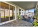 Cozy covered patio with outdoor seating, ideal for relaxing and enjoying the backyard at 34244 Radley Way, Wesley Chapel, FL 33545