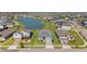 A view of the neighborhood houses and the pond at 34311 Evergreen Hill Ct, Wesley Chapel, FL 33545