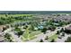 Aerial view of community pool and amenities nestled among lush greenery in a Gathering-friendly neighborhood at 34311 Evergreen Hill Ct, Wesley Chapel, FL 33545