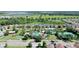 Aerial view of a resort-style community showcasing a large pool, tennis courts, and lush landscaping at 34311 Evergreen Hill Ct, Wesley Chapel, FL 33545
