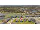 Aerial view of a house in a neighborhood, marked with a pin for location, showcasing pond and green spaces at 34311 Evergreen Hill Ct, Wesley Chapel, FL 33545