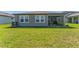 A backyard with a view of the home's screened in patio at 34311 Evergreen Hill Ct, Wesley Chapel, FL 33545