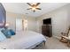 This bedroom boasts neutral walls, carpet flooring, ceiling fan, and a spacious closet at 34311 Evergreen Hill Ct, Wesley Chapel, FL 33545