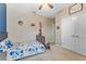 Inviting bedroom with ceiling fan, closet, and decor at 34311 Evergreen Hill Ct, Wesley Chapel, FL 33545