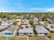 Aerial view of home showing the neighborhood, the backyard, and the front lawn at 3615 16Th N St, St Petersburg, FL 33704