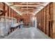 Spacious garage with exposed beams, concrete floor, and built-in shelving along the walls at 3615 16Th N St, St Petersburg, FL 33704