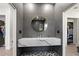 Modern bathroom boasts stylish vanity and views into bedroom and closet at 3635 80Th E Dr, Sarasota, FL 34243