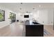 Kitchen features island seating and is open to the spacious living area at 3635 80Th E Dr, Sarasota, FL 34243