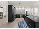 Modern kitchen featuring stainless appliances, island seating, and designer touches at 3635 80Th E Dr, Sarasota, FL 34243