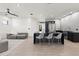 Open kitchen with large island and seating flows to light and airy living room at 3635 80Th E Dr, Sarasota, FL 34243
