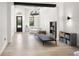 Bright living area features wood floors, modern lighting, and stylish decor at 3635 80Th E Dr, Sarasota, FL 34243
