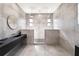 The spacious bathroom features an elegant vanity and glass-enclosed shower at 3635 80Th E Dr, Sarasota, FL 34243