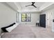 The main bedroom includes a neutral color palette and an ensuite bath at 3635 80Th E Dr, Sarasota, FL 34243