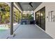 Outdoor kitchen with full bar in screened lanai near pool at 3635 80Th E Dr, Sarasota, FL 34243