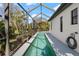 Gorgeous lap pool with screened enclosure offering privacy and space at 3635 80Th E Dr, Sarasota, FL 34243